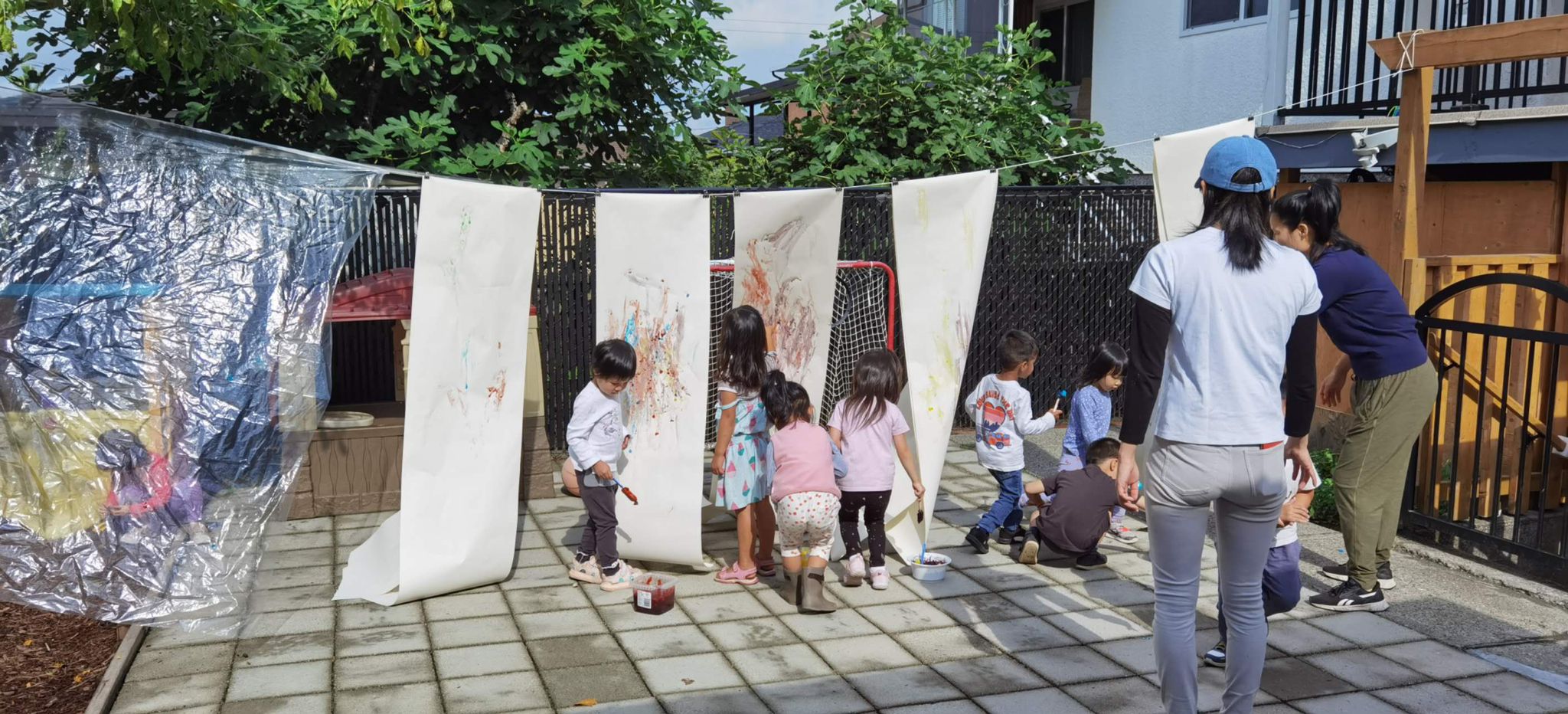 Daycare Children doing art in the back yard