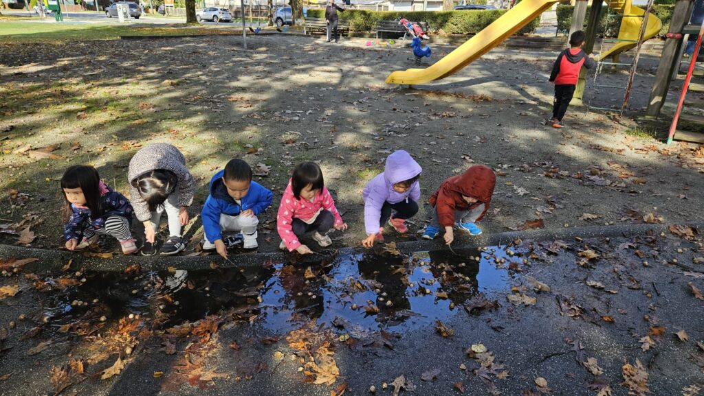 Daycare - Outdoor - Group playing with rain water at Park